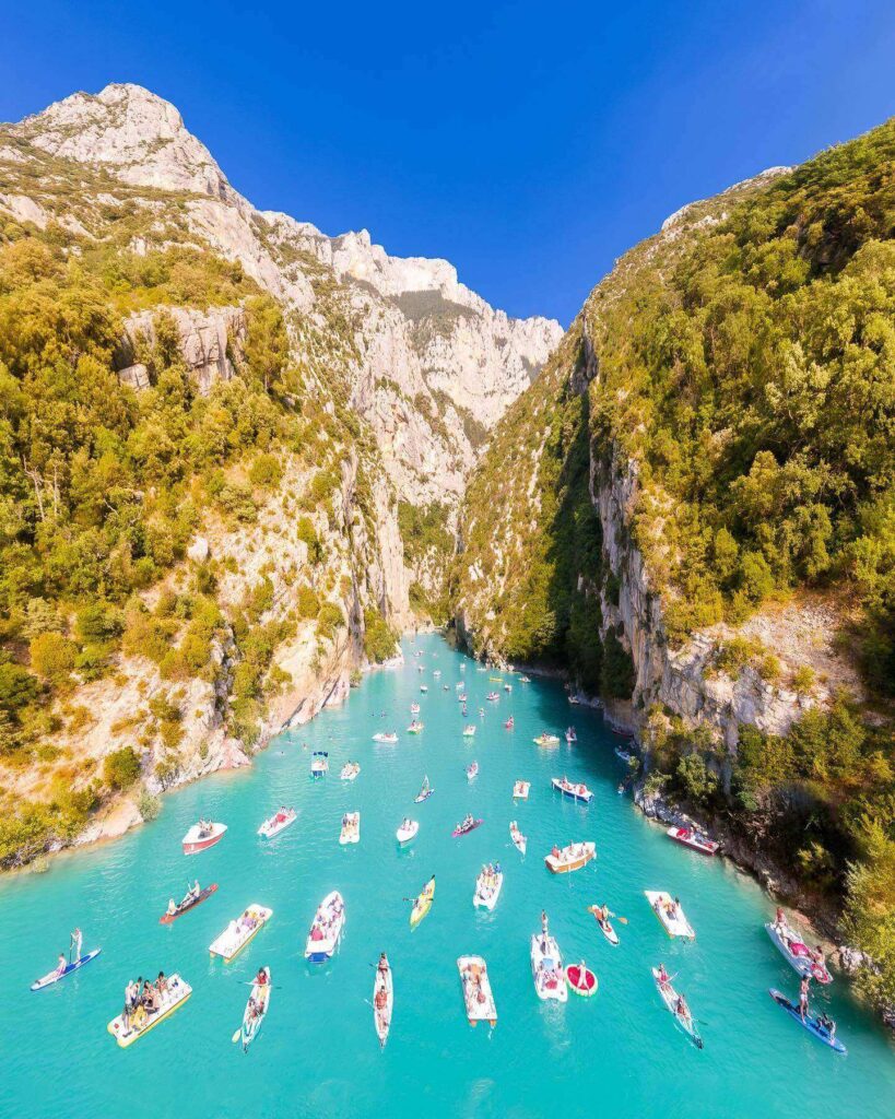 Visitors kayaking through the turquoise waters of Gorges du Verdon