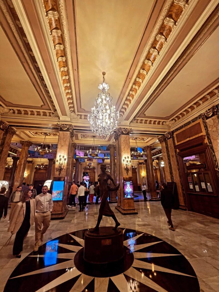 Grand atrium inside Monte Carlo Casino with marble floors and decorative details