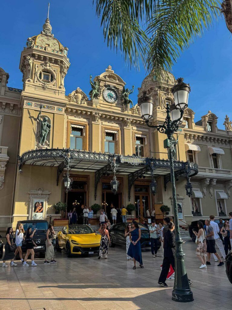Elegantly dressed visitors arriving at Monte Carlo Casino