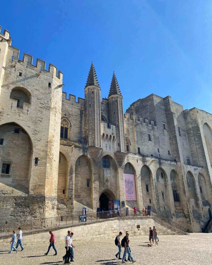 Visitors entering Palais des Papes in Avignon during the morning