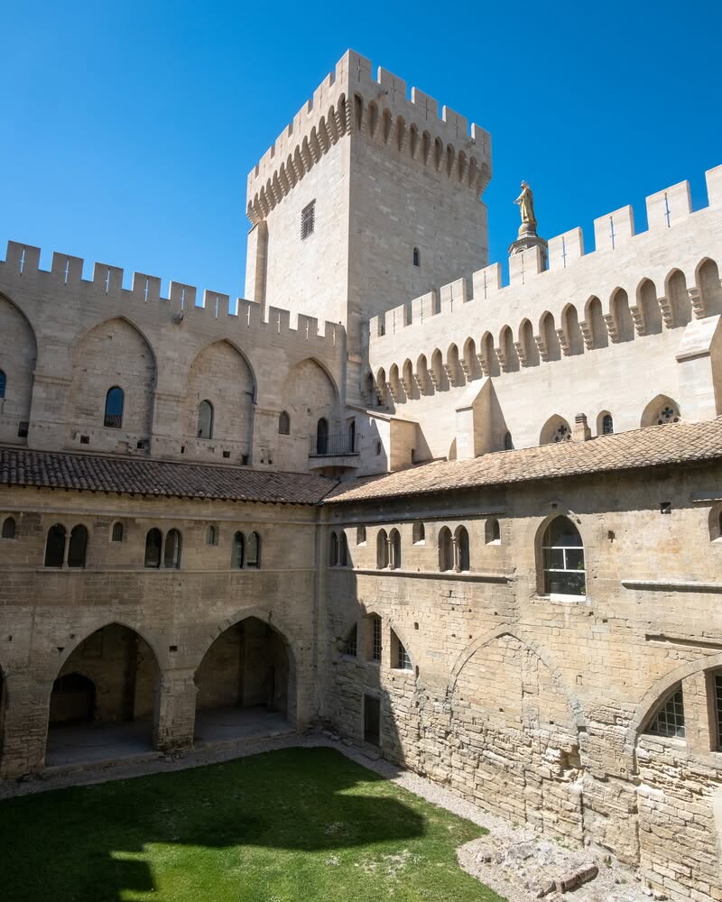 Defensive towers and stone walls of the Palais Vieux at Palais des Papes