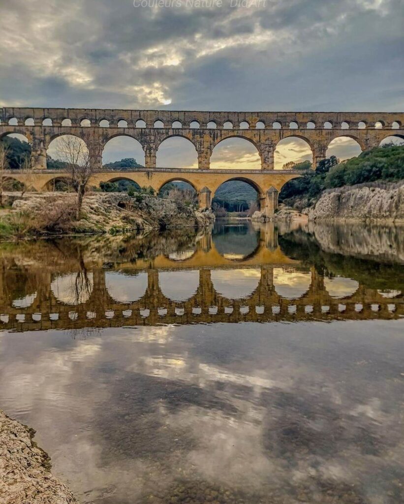 Golden hour view of Pont du Gard above the Gardon River