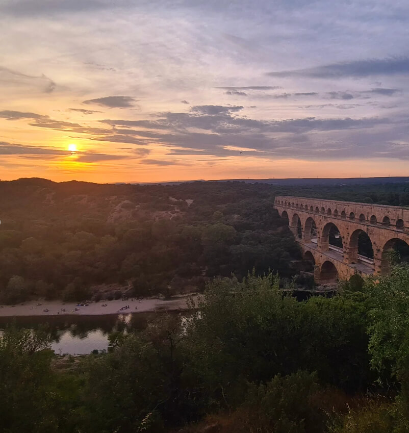 Pont du Gard illuminated by golden sunset light in southern France