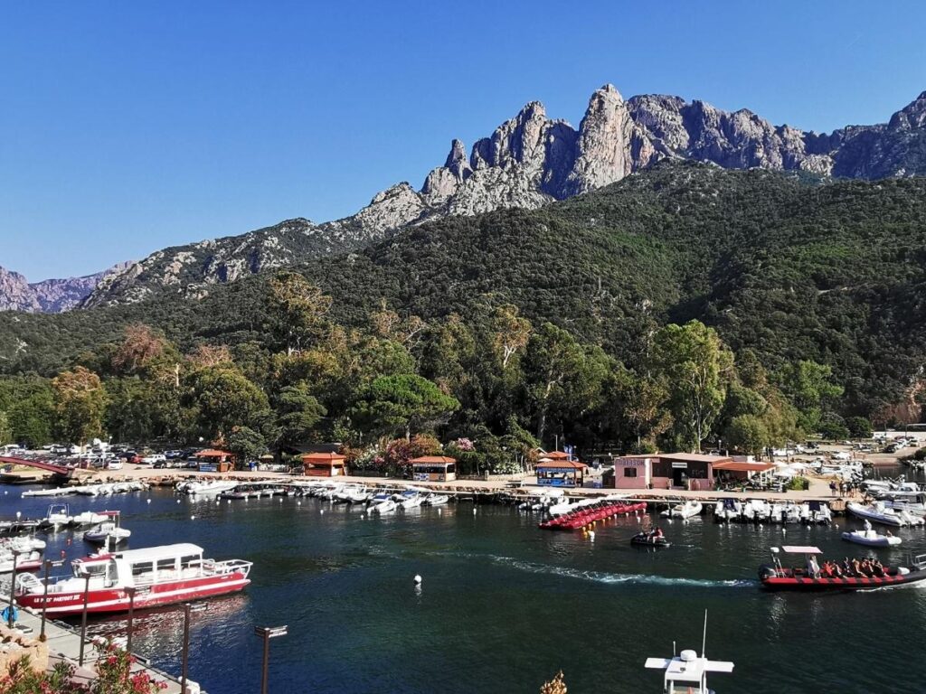Marina and waterfront in Porto, Corsica, a popular base for visiting Scandola