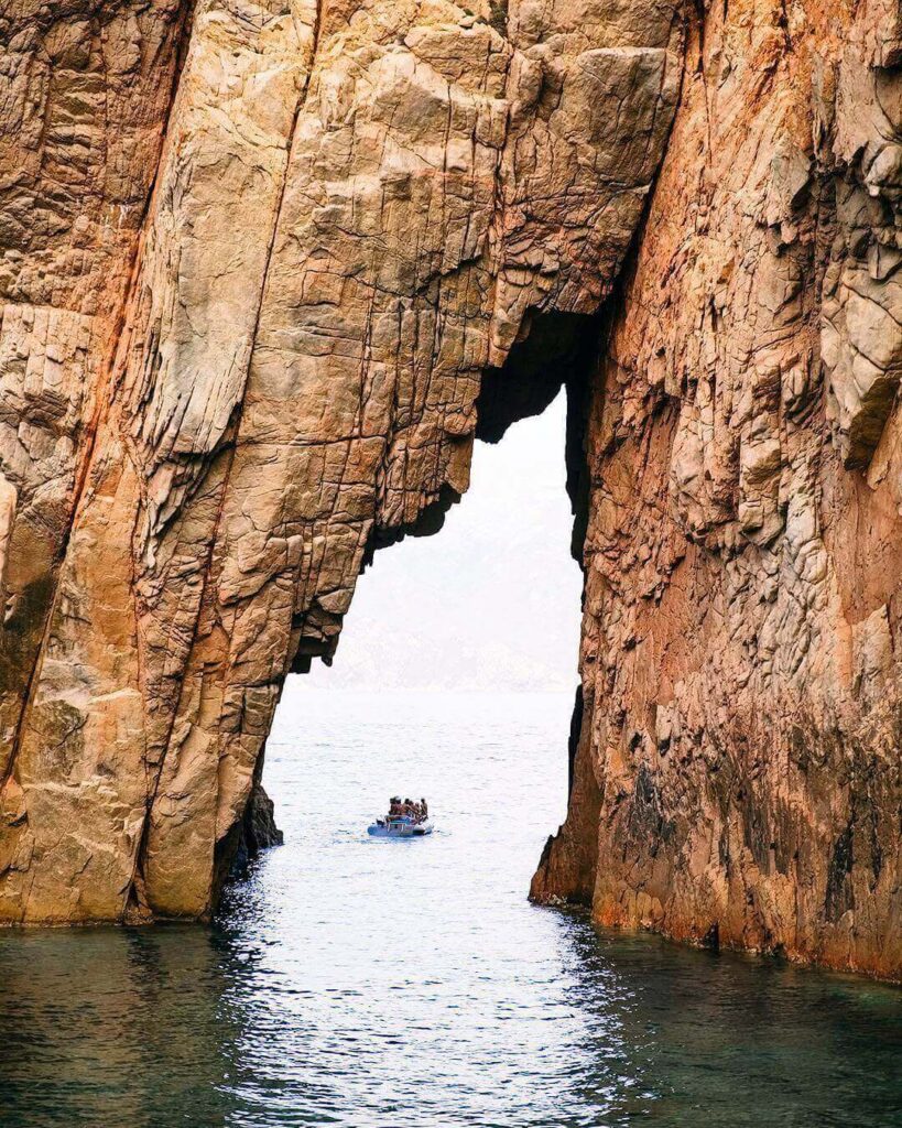 Natural rock arch and volcanic formations in Scandola Nature Reser
