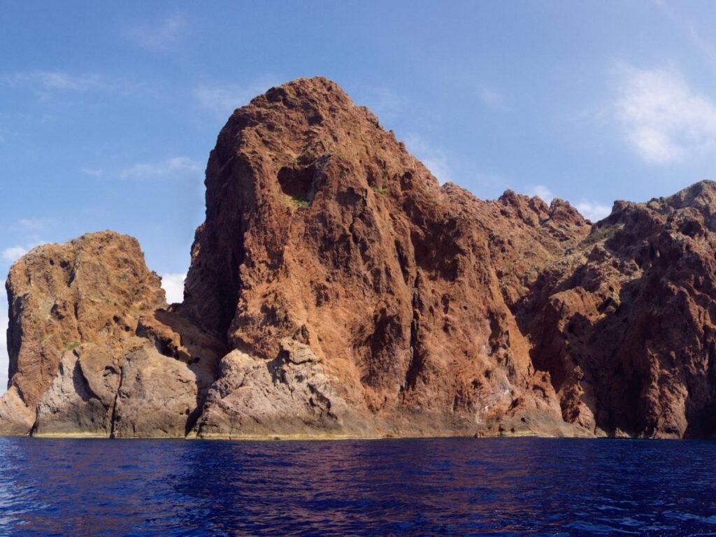 Osprey perched on rocky cliffs in Scandola Nature Reserve, Corsica