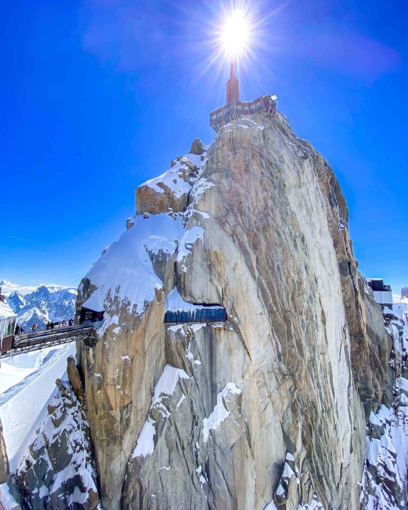 Spring scenery in Chamonix with snow remaining on the upper slopes of Aiguille du Midi