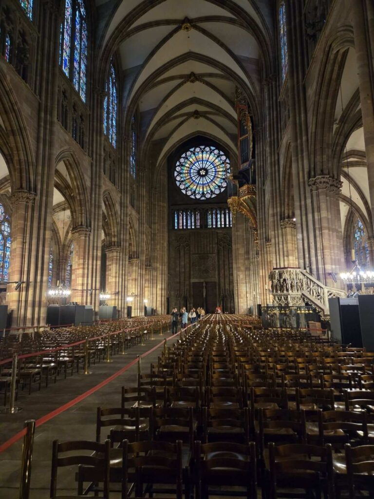 Interior of Strasbourg Cathedral with soaring Gothic columns and stained glass windows