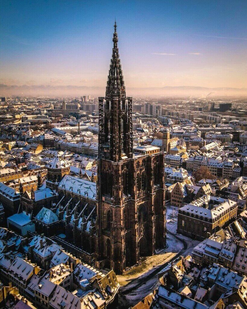 Upward view of Strasbourg Cathedral's 142-meter Gothic spire