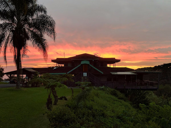 The Inn at Kulaniapia Falls in Hilo, Hawaii, featuring a private waterfall, lush rainforest surroundings, charming boutique accommodations, and a secluded nature-focused retreat experience.