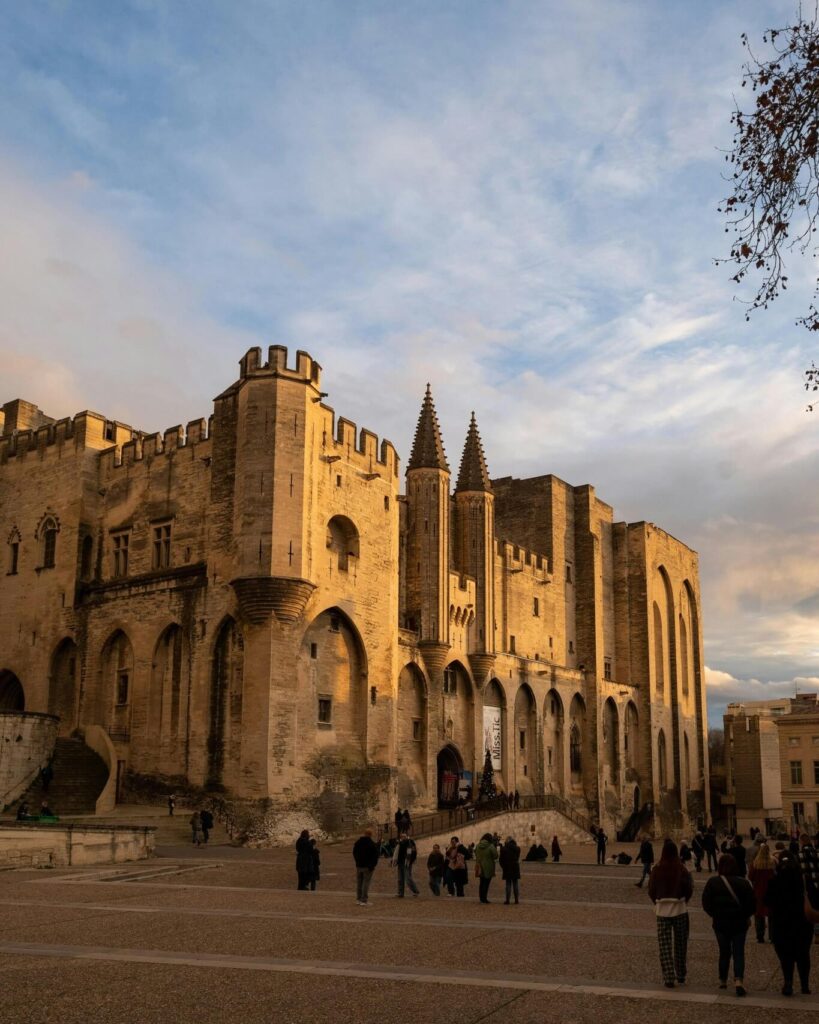 Visitors exploring Palais des Papes in Avignon