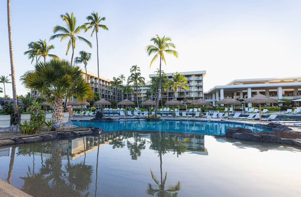 Scenic view of Waikoloa Beach Marriott Resort & Spa on Hawaii's Big Island, featuring oceanfront pools, lush tropical landscaping, nearby white-sand beaches, and a relaxing Hawaiian resort atmosphere.