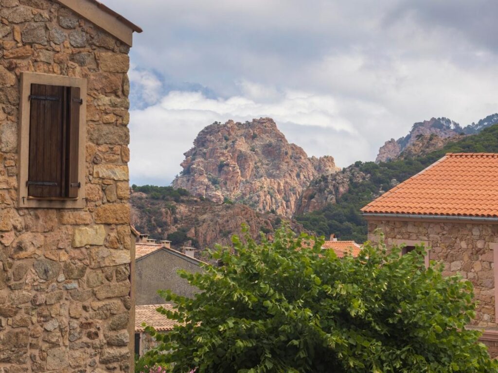 View of the Calanques de Piana region with nearby villages and coastline in Corsica