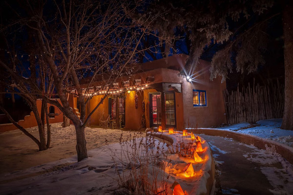 Scenic outdoor patio at Adobe & Pines Inn with mountain views and comfortable seating for guests.