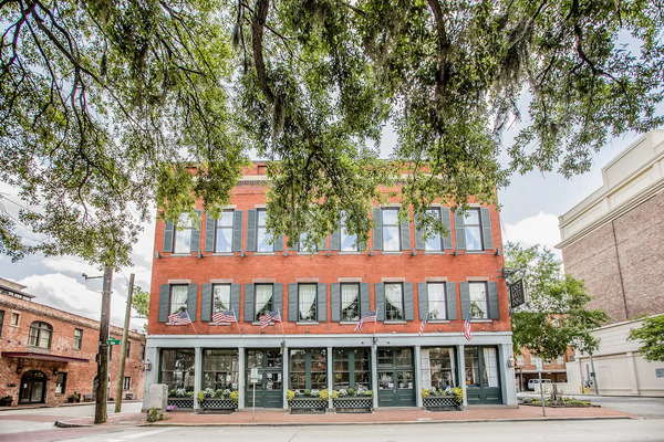 Exterior view of East Bay Inn, a historic boutique hotel in Savannah, Georgia.