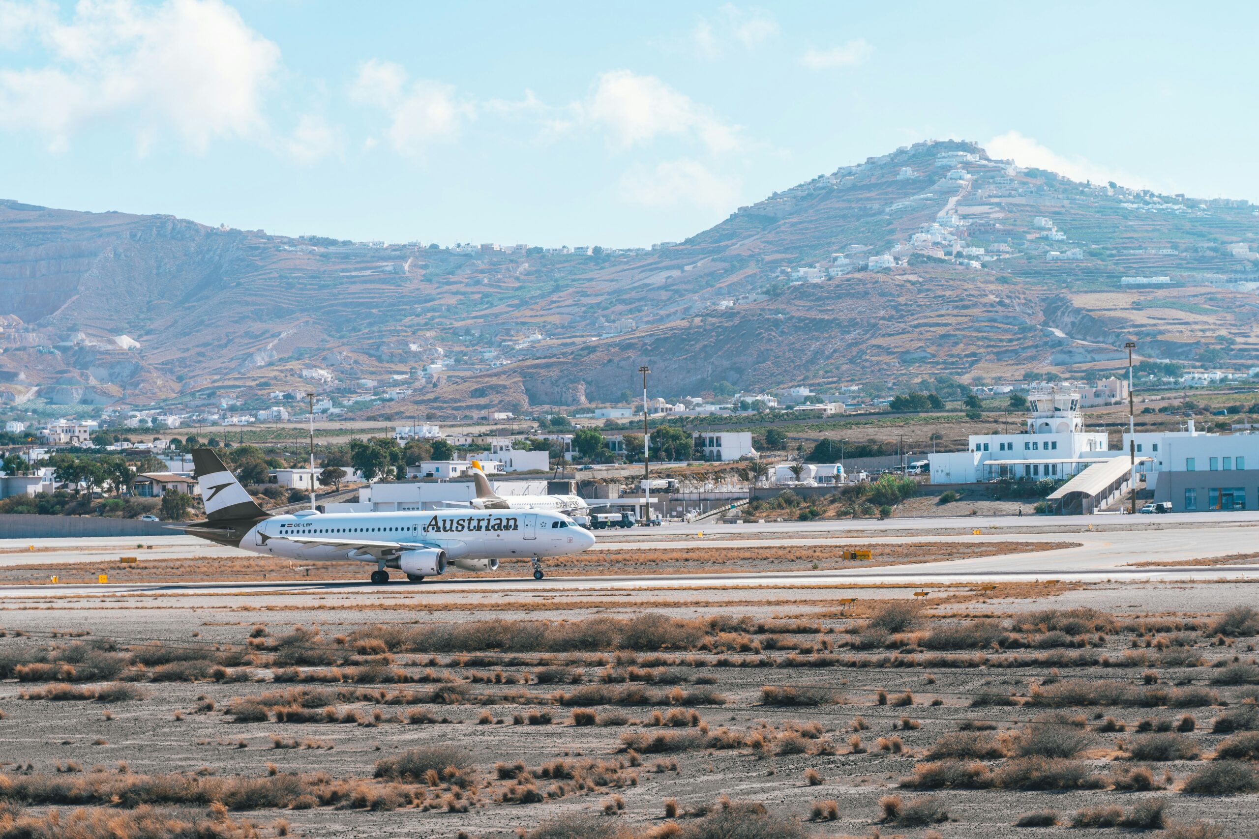 Crowded European airport terminal during peak summer travel season