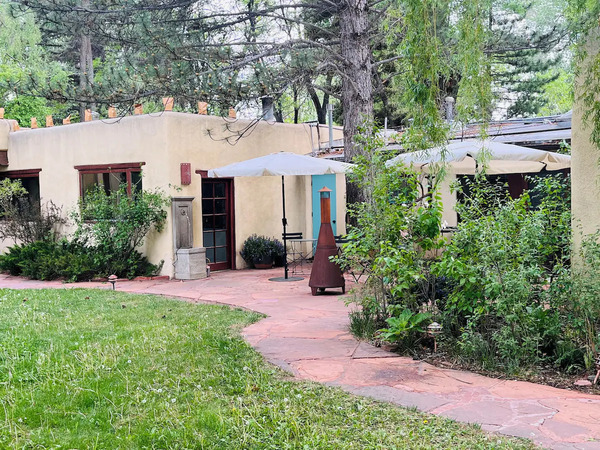 Luxury suite at Hacienda del Sol with premium furnishings, comfortable bedding, and private outdoor space.