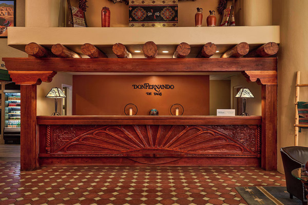 Exterior view of Hotel Don Fernando de Taos, Tapestry Collection by Hilton featuring elegant Southwestern architecture.