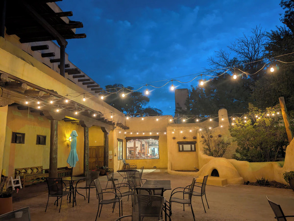 Main entrance of Sagebrush Inn & Suites with char