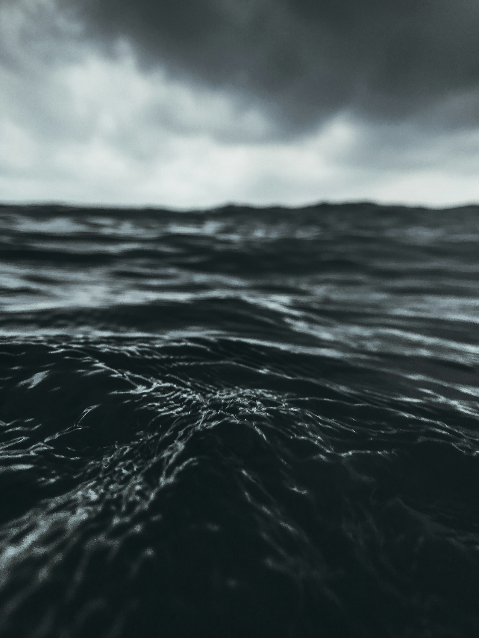 Stormy ocean waves under grey skies as Super Typhoon Bavi churns across the Pacific