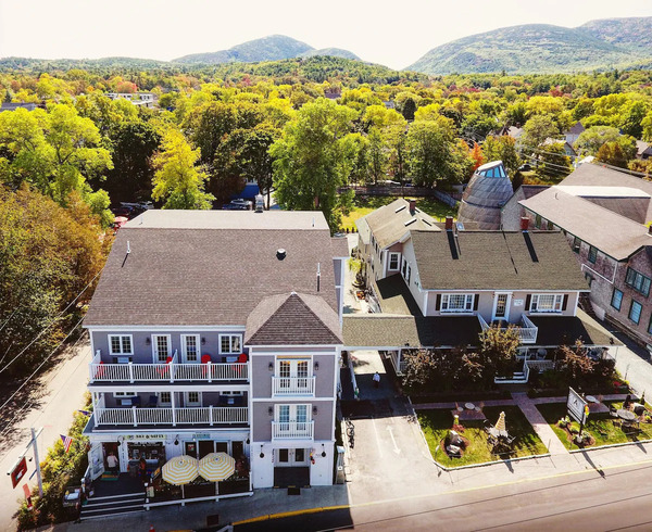 Acadia Hotel in downtown Bar Harbor, Maine, featuring its charming exterior and convenient location near local attractions.
