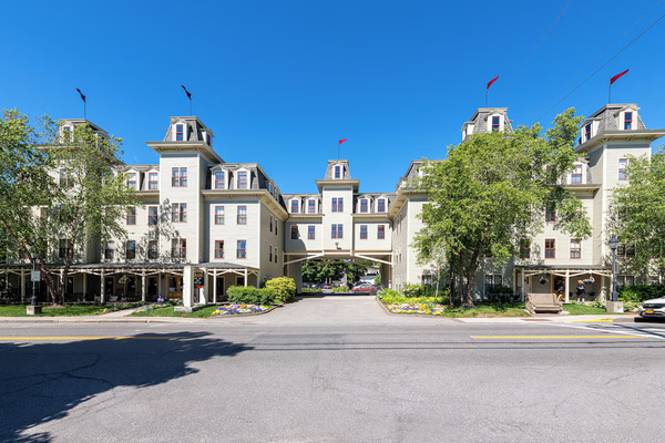 Bar Harbor Grand Hotel in Bar Harbor, Maine, showcasing its elegant exterior and welcoming hotel entrance.
