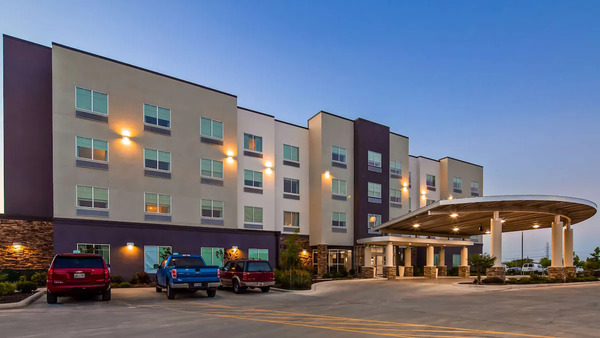 Exterior view of Best Western Plus Roland Inn & Suites in San Antonio, featuring a modern hotel facade, landscaped surroundings, and comfortable accommodations near downtown San Antonio.