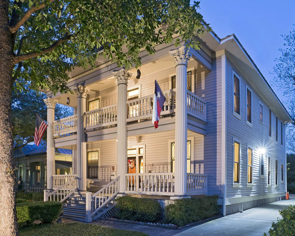Exterior view of Brackenridge House Bed & Breakfast in San Antonio, featuring a charming historic house, inviting entrance, landscaped gardens, and a cozy boutique lodging atmosphere.