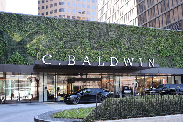 Exterior view of C. Baldwin, Curio Collection by Hilton in downtown Houston, featuring contemporary architecture, stylish accommodations, modern amenities, and upscale hospitality near the city's business and entertainment districts.