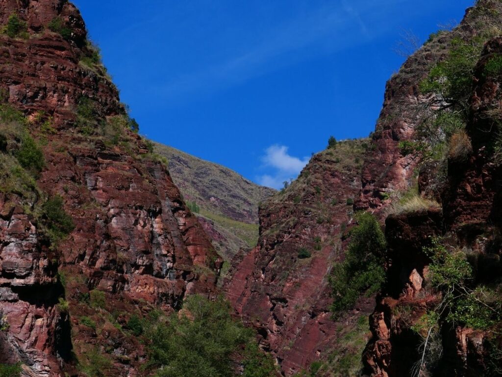 Red rock cliffs and winding road through Cians Valley in southern France