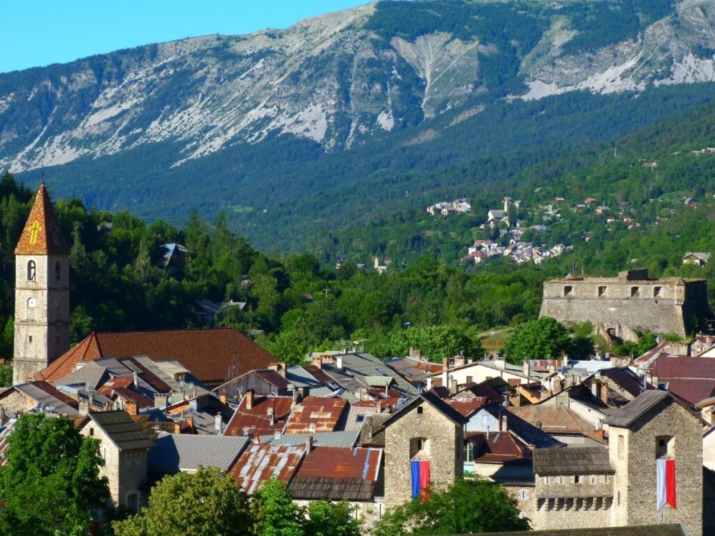 Fortified village of Colmars-les-Alpes surrounded by alpine mountains