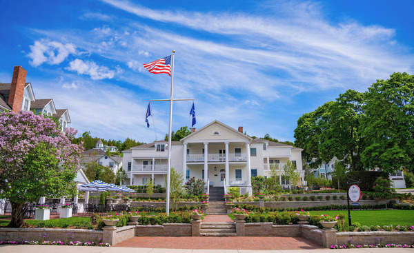 Harbour View Inn on Mackinac Island featuring elegant Victorian-style accommodations, colorful gardens, comfortable guest rooms, and a welcoming atmosphere near the waterfront.