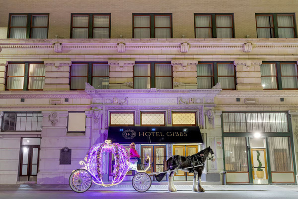Exterior view of Hotel Gibbs Downtown San Antonio Riverwalk in San Antonio, featuring historic architecture, an elegant facade, and a convenient location near the Alamo and River Walk.