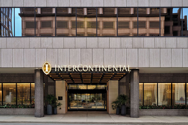 Exterior view of InterContinental San Antonio Riverwalk by IHG, featuring modern luxury architecture, an elegant hotel facade, and a prime location near the San Antonio River Walk.