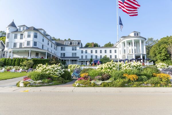 Island House Hotel on Mackinac Island featuring historic Victorian architecture, waterfront views, elegant guest rooms, and scenic Lake Huron surroundings.