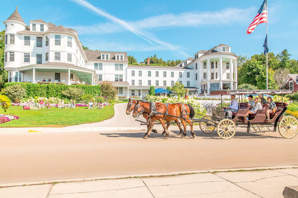 Island House Hotel on Mackinac Island featuring historic Victorian architecture, elegant waterfront accommodations, beautiful lake views, and classic island charm near Lake Huron.