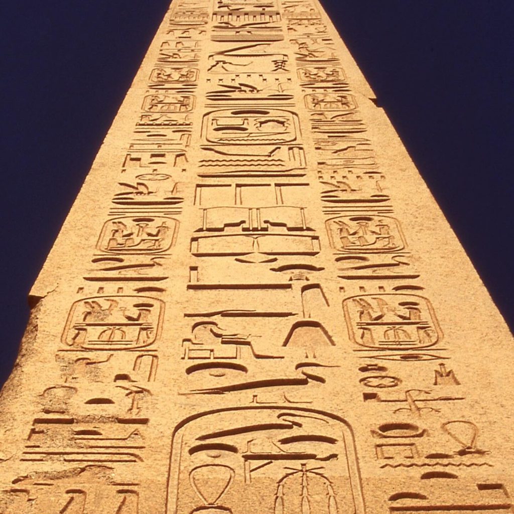 Ancient Egyptian hieroglyphs carved into the Luxor Obelisk at Place de la Concorde