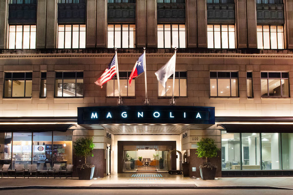 Exterior view of Magnolia Hotel Houston, A Tribute Portfolio Hotel, showcasing its historic downtown architecture, elegant accommodations, modern amenities, and convenient location in Houston, Texas.