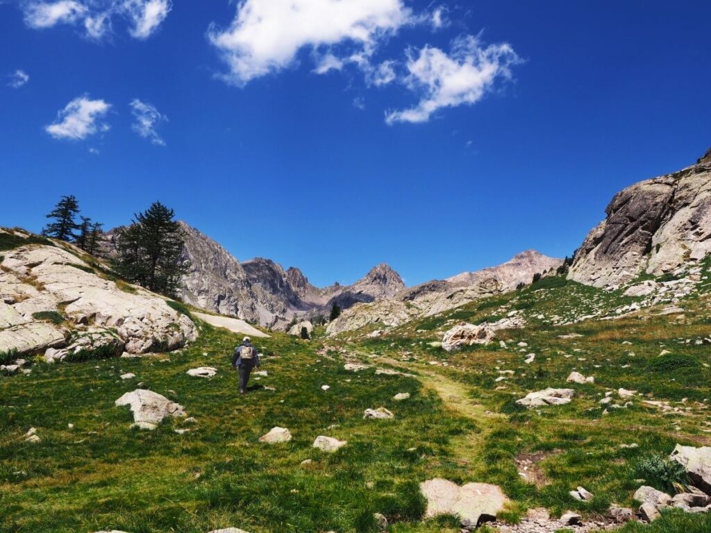 Hiker following a marked trail in Mercantour National Park