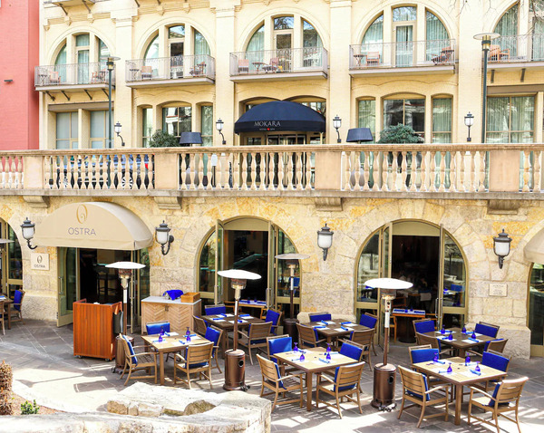 Exterior view of Mokara Hotel & Spa, a luxury boutique hotel overlooking the San Antonio River Walk, featuring elegant architecture, upscale accommodations, and a relaxing spa atmosphere.
