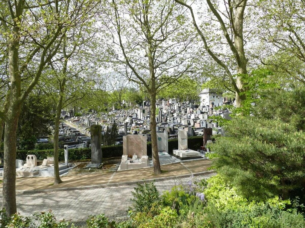 Long walking path through Père Lachaise Cemetery in Paris