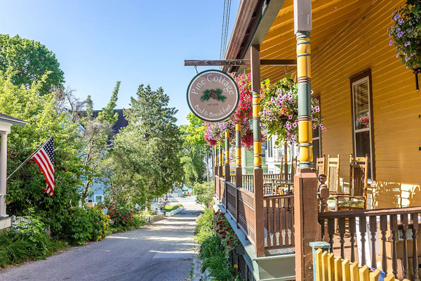 Pine Cottage Bed & Breakfast on Mackinac Island featuring cozy accommodations, Victorian-style charm, comfortable guest rooms, and a welcoming atmosphere near downtown attractions.