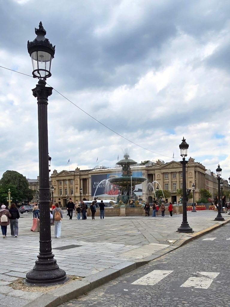 Visitors walking around Place de la Concorde in Paris