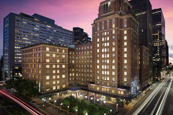 Exterior view of SpringHill Suites Houston Downtown/Convention Center, featuring modern all-suite accommodations, contemporary architecture, complimentary breakfast, and a convenient location near Houston’s George R. Brown Convention Center and downtown attractions.