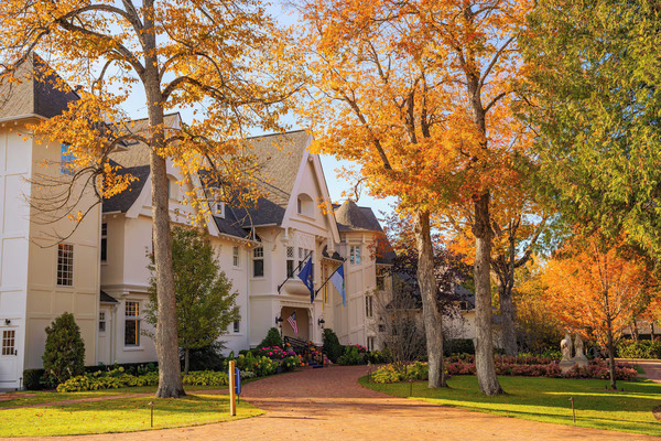 The Inn at Stonecliffe on Mackinac Island featuring a historic estate, elegant accommodations, lush gardens, and panoramic views of the Mackinac Bridge and Lake Huron.