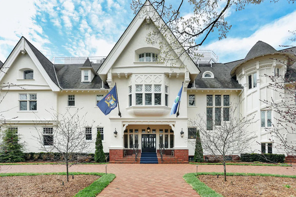 The Inn at Stonecliffe on Mackinac Island featuring elegant accommodations, historic estate architecture, scenic gardens, and panoramic views of Lake Huron and the Mackinac Bridge.