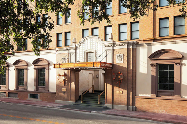 Front exterior of The St. Anthony, a Luxury Collection Hotel in San Antonio, showcasing its historic Beaux-Arts architecture, elegant entrance, and iconic luxury ambiance.