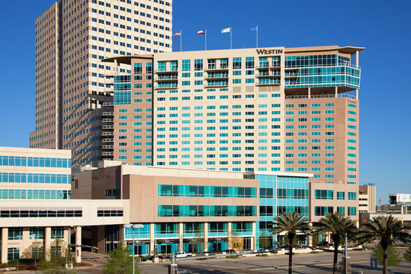 Exterior view of The Westin Houston Memorial City, an upscale hotel featuring modern architecture, comfortable guest rooms, premium amenities, and a prime location connected to Memorial City Mall in Houston, Texas.
