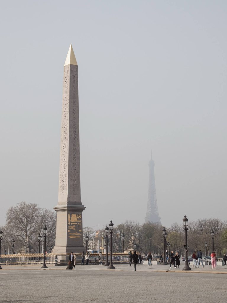 People walking around Place de la Concorde in Paris