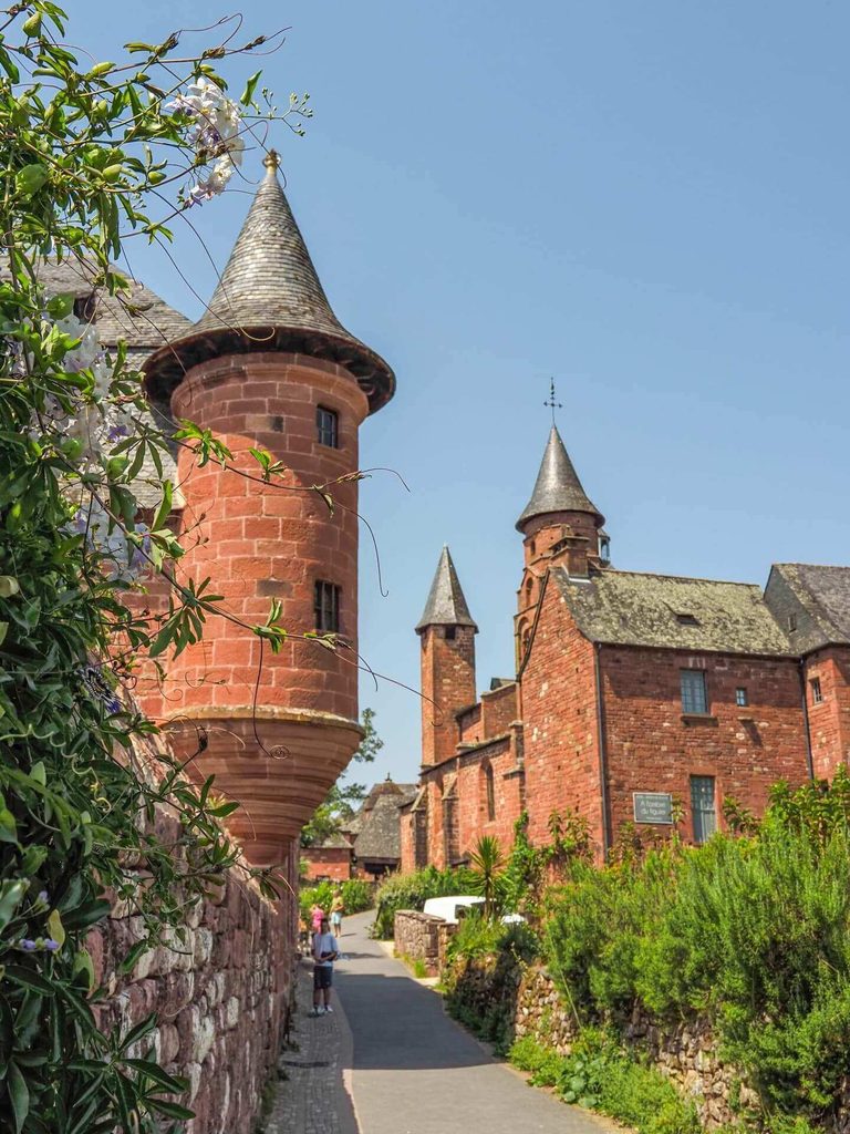 Historic towers and turrets above the rooftops of Collonges-la-Rouge